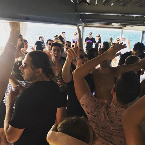 LIONFISH IV CHARTERS PARTY CROWD DANCING BOAT HIRE