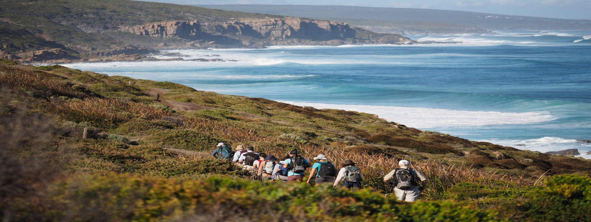 WALKING TOURS Western Australia group in line along cliff