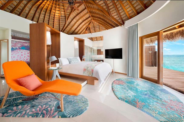 W-MALDIVES-orange-couch-water-villa