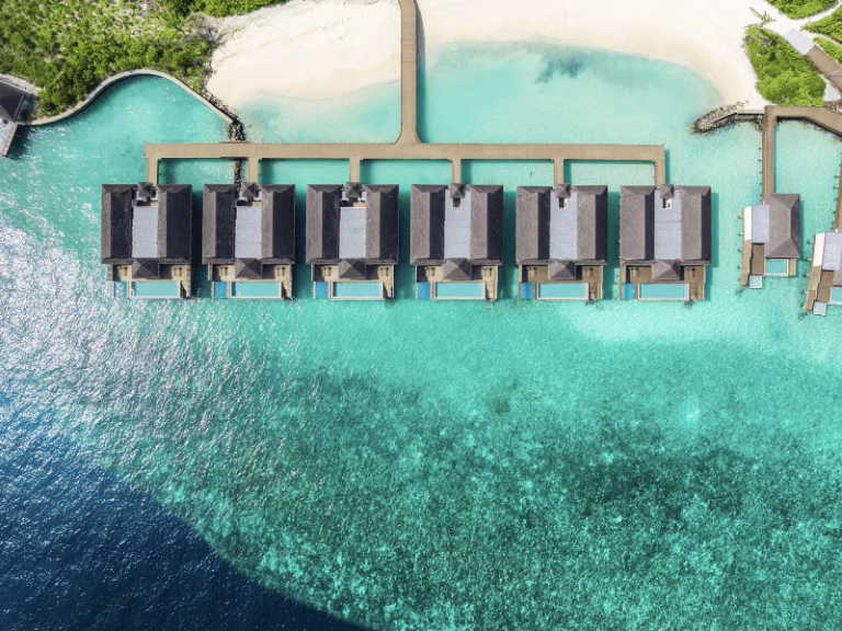 DusitD2 Feydhoo Maldives overwater villas in a line beach access