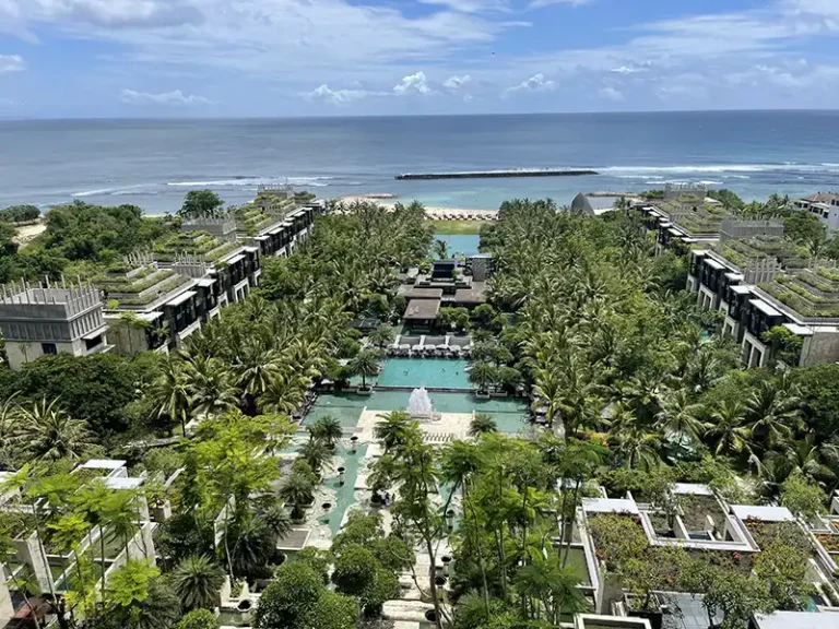 KEMPINSKI Nusa Dua view down from upper level over pool to ocean