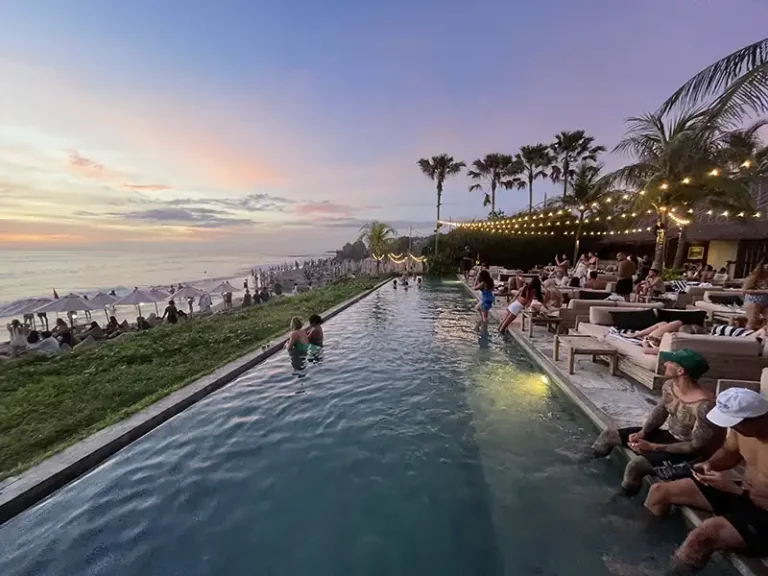 THE LAWN beach club Canggu people by pool waiting for sunset